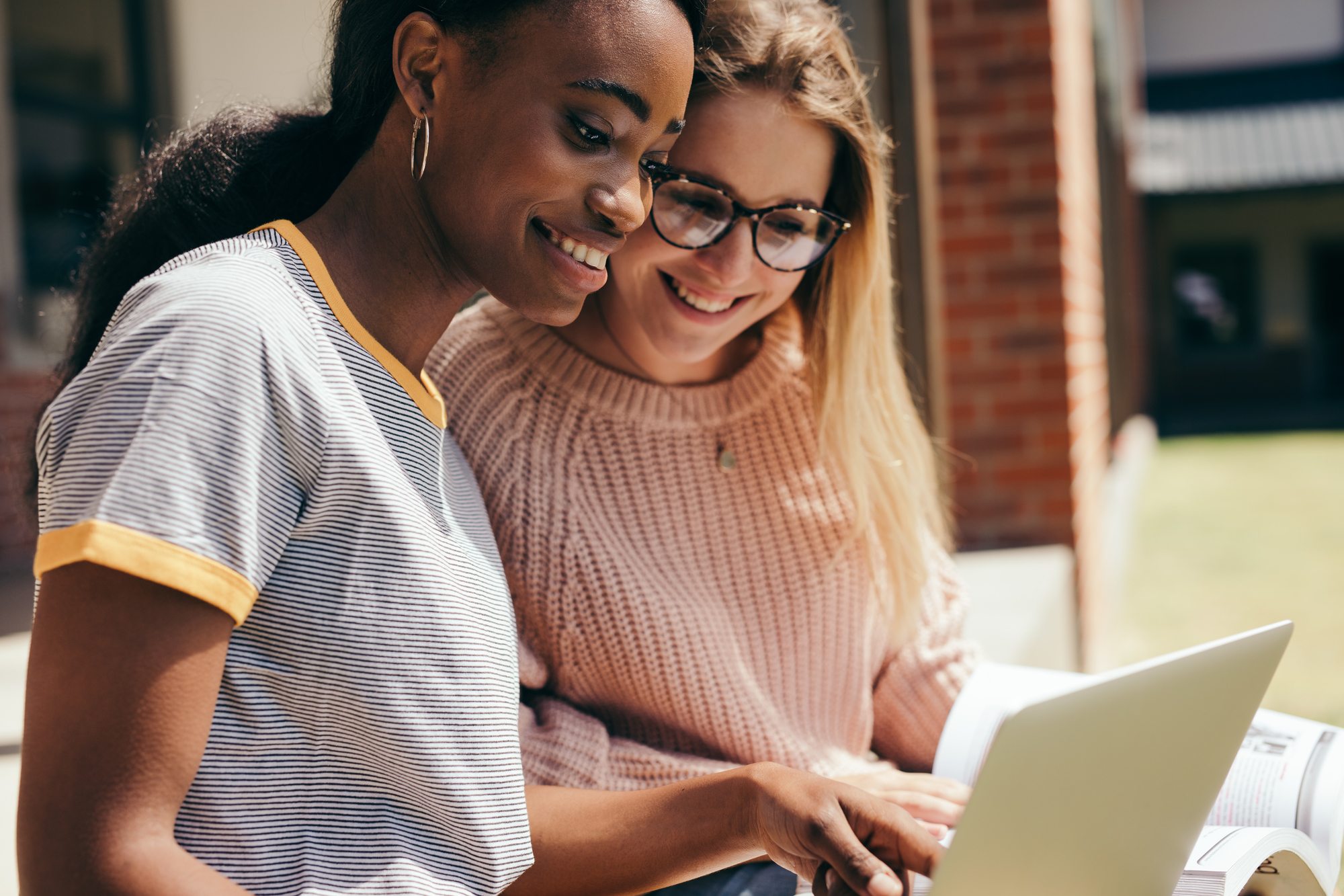 Two young girls with a laptop
