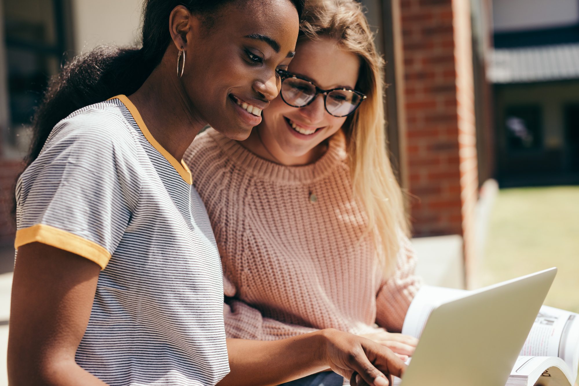 Two young girls with a laptop