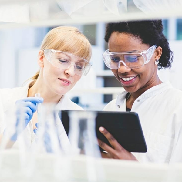 stock photo of two female scientist working with tablet