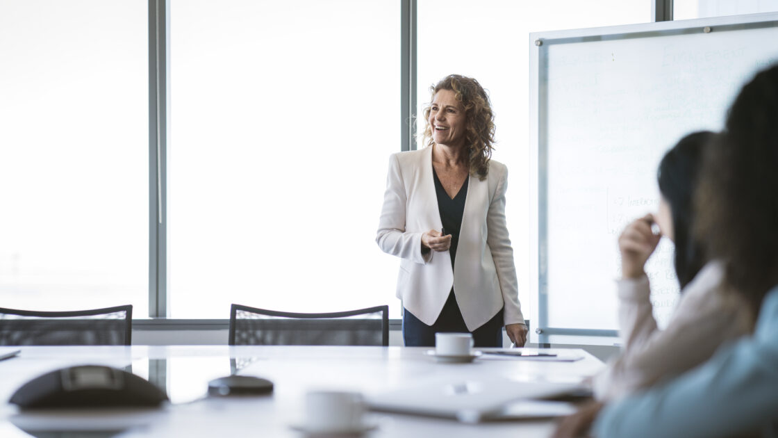businesswoman giving presentation at office