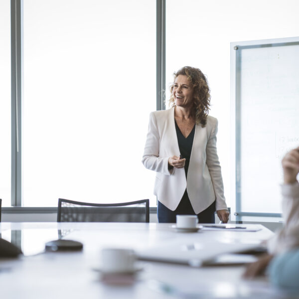 businesswoman giving presentation at office