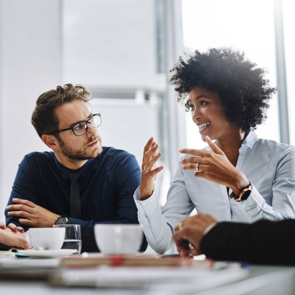 group of businesspeople sitting together in a meeting