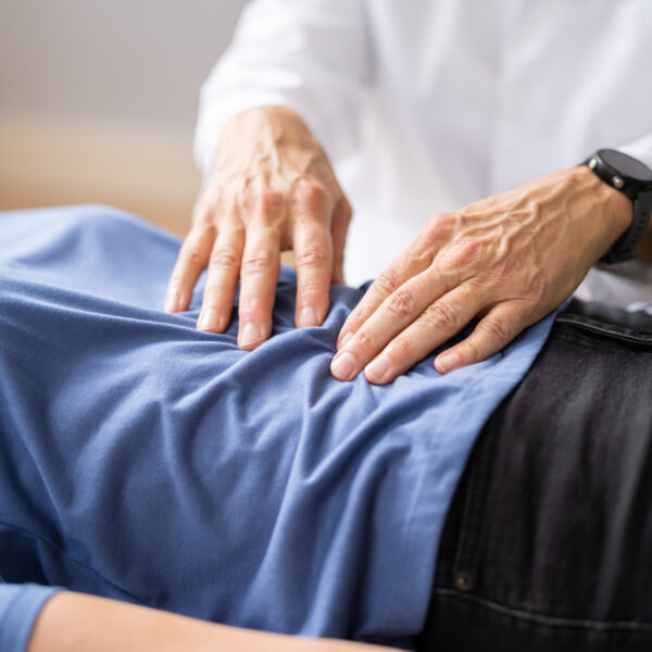 Gastroenterologist doctor consulting woman in clinic