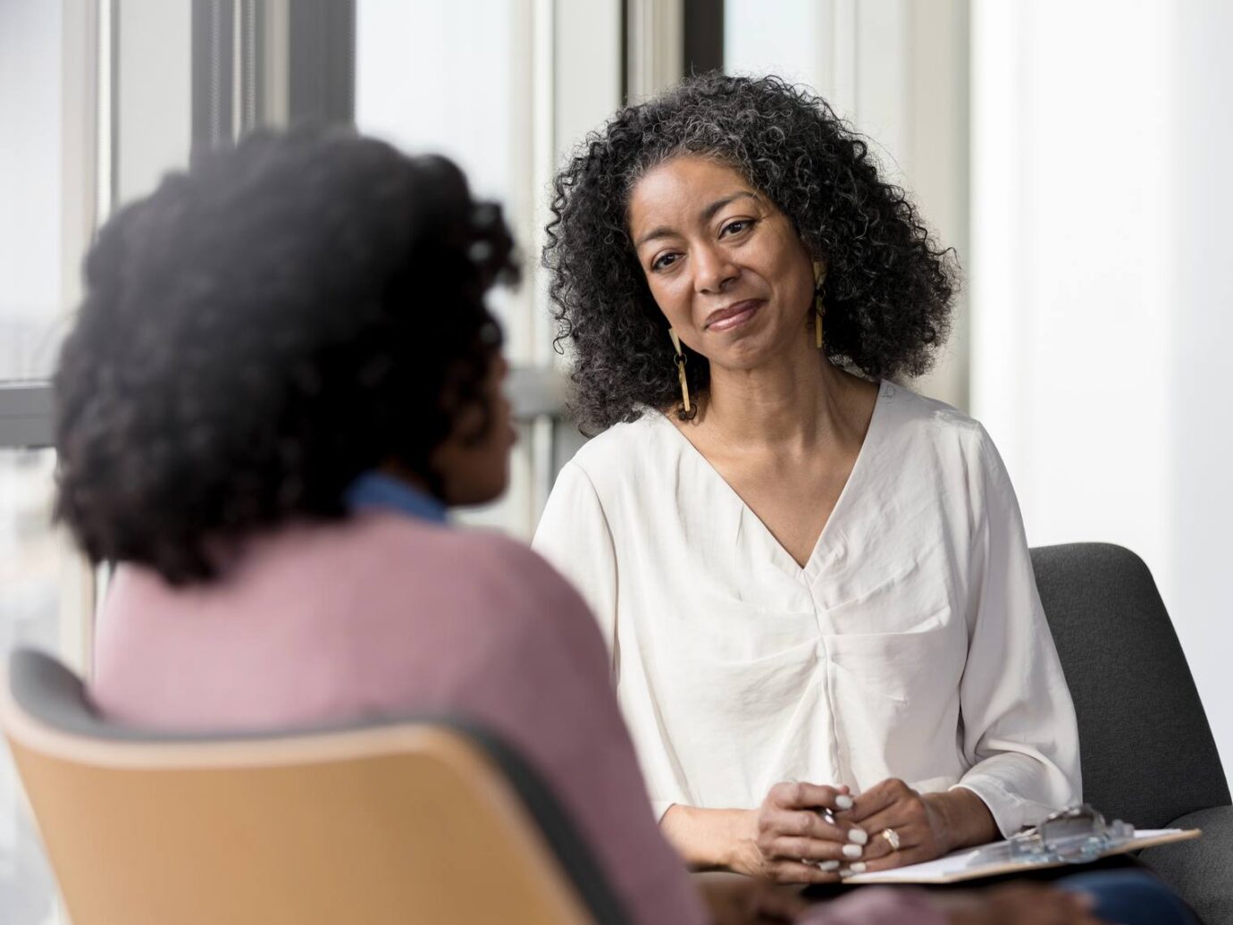 counselor listening to her female client