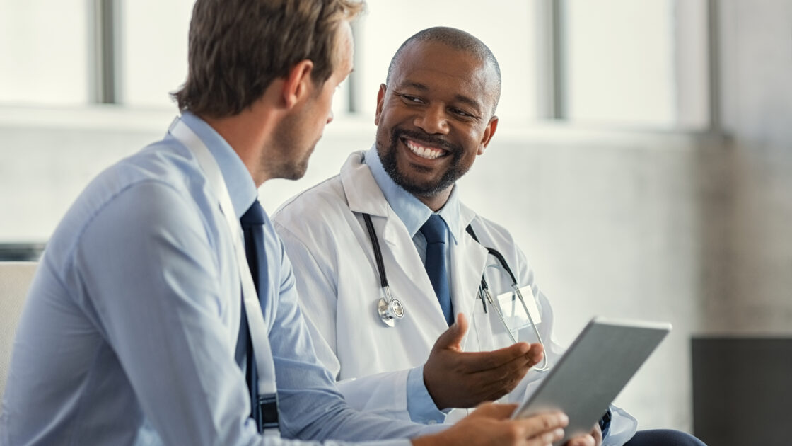 Two doctors having discussion about patient diagnosis