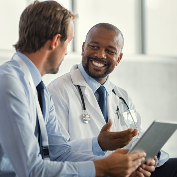 Two doctors having discussion about patient diagnosis