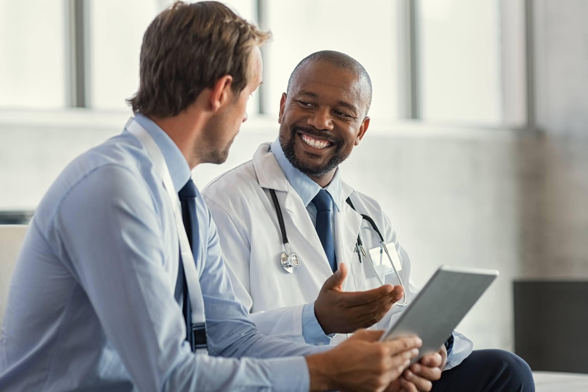 Two doctors having discussion about patient diagnosis