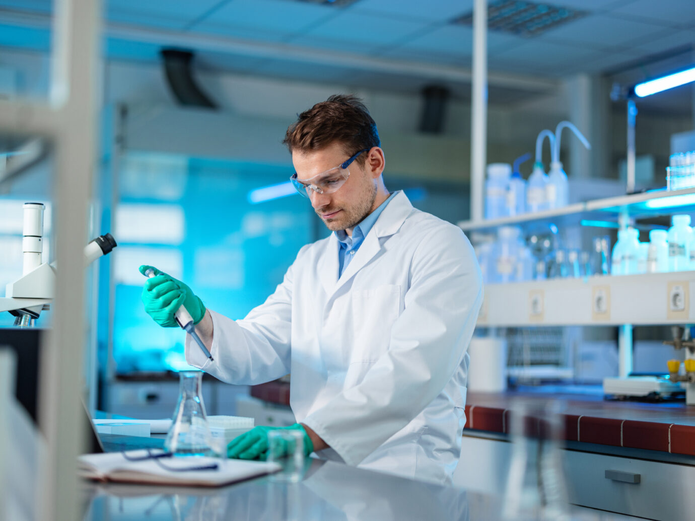 Biochemist Mixing Liquid Chemical Using Pipette