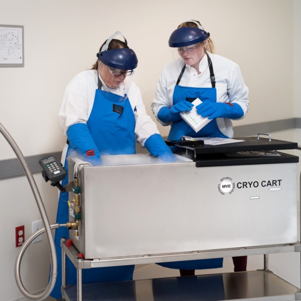 scientist working with a nitrogen and cryo cart