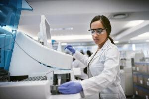 women scientist working on machine