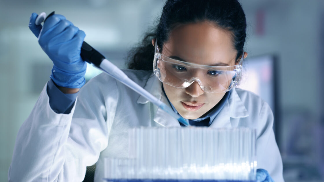 female scientist pipetting liquid