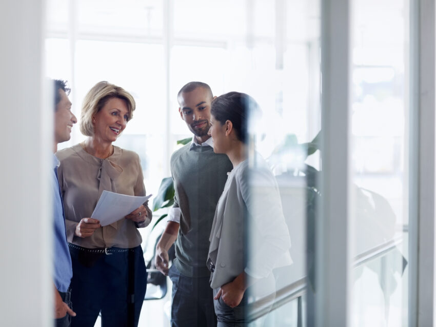 Businesswoman discussing with colleagues