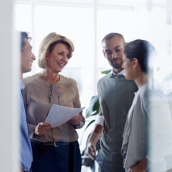 Businesswoman discussing with colleagues