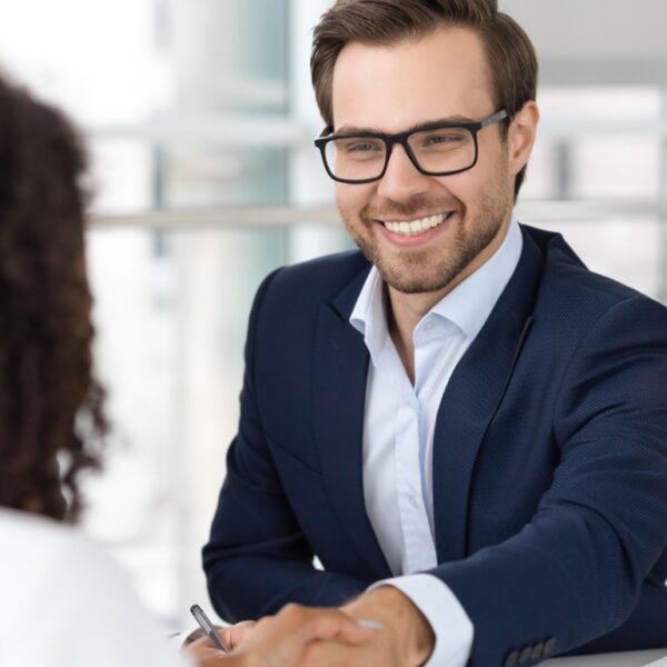 businessman shaking hands with candidate