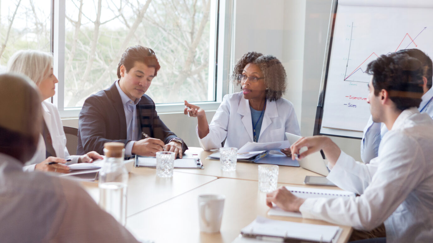 doctor discusses something during conference