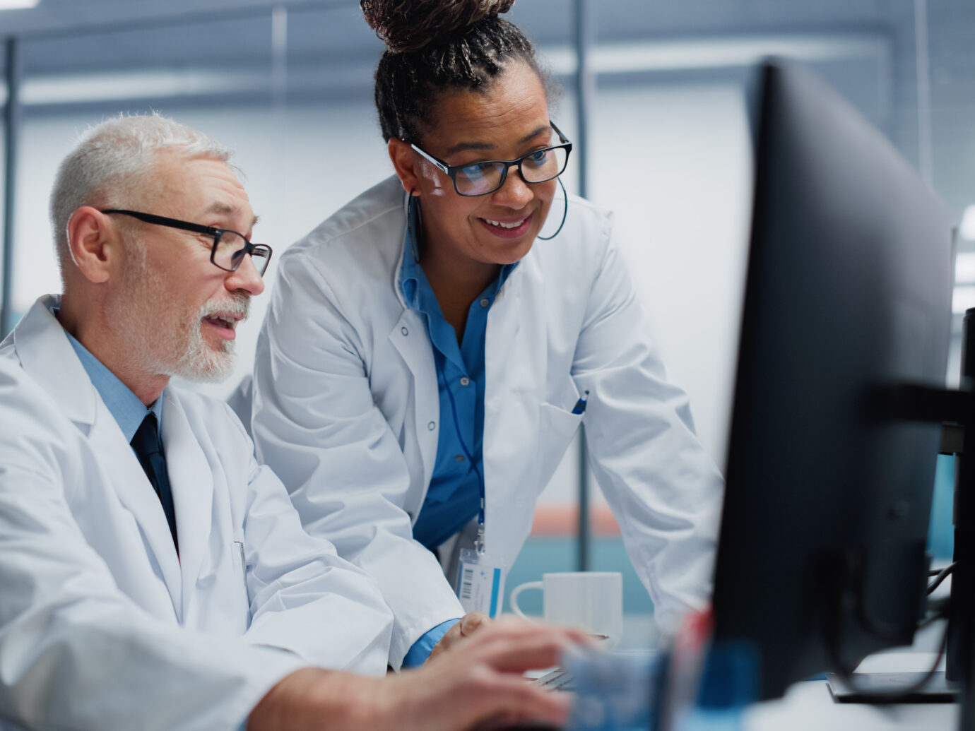 Two doctors looking at a computer