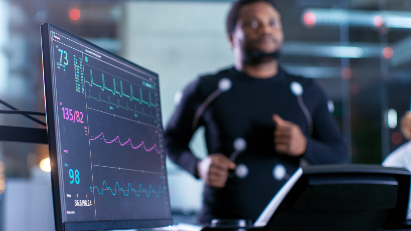 Male Athlete Runs on a Treadmill