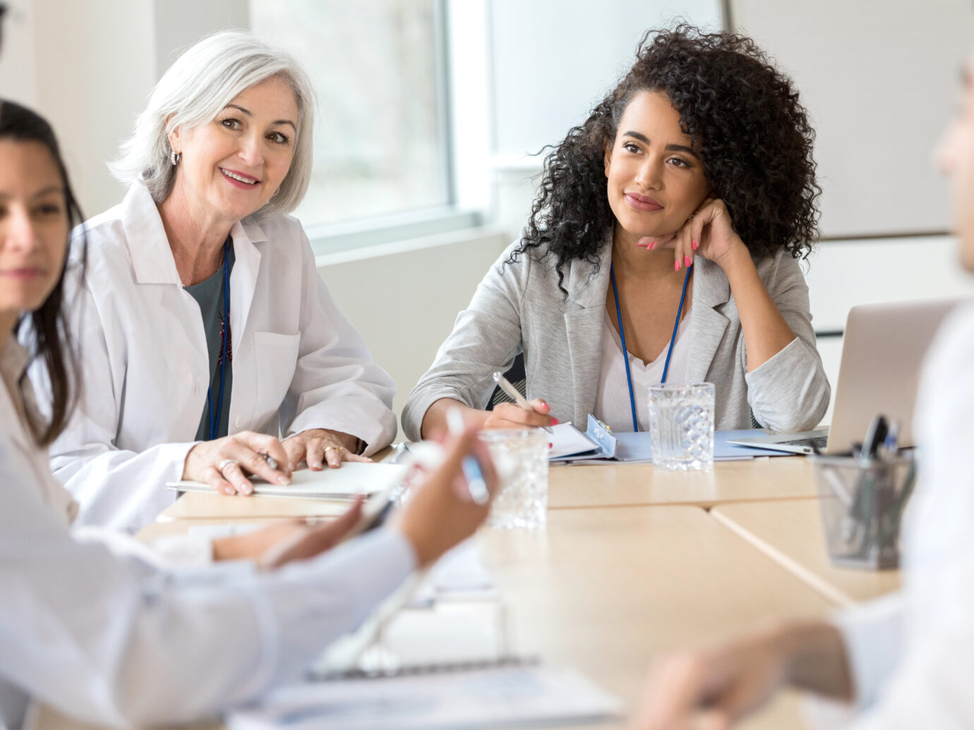 hospital executive meets with medical staff