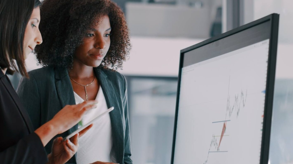 businesswomen using an interactive whiteboard