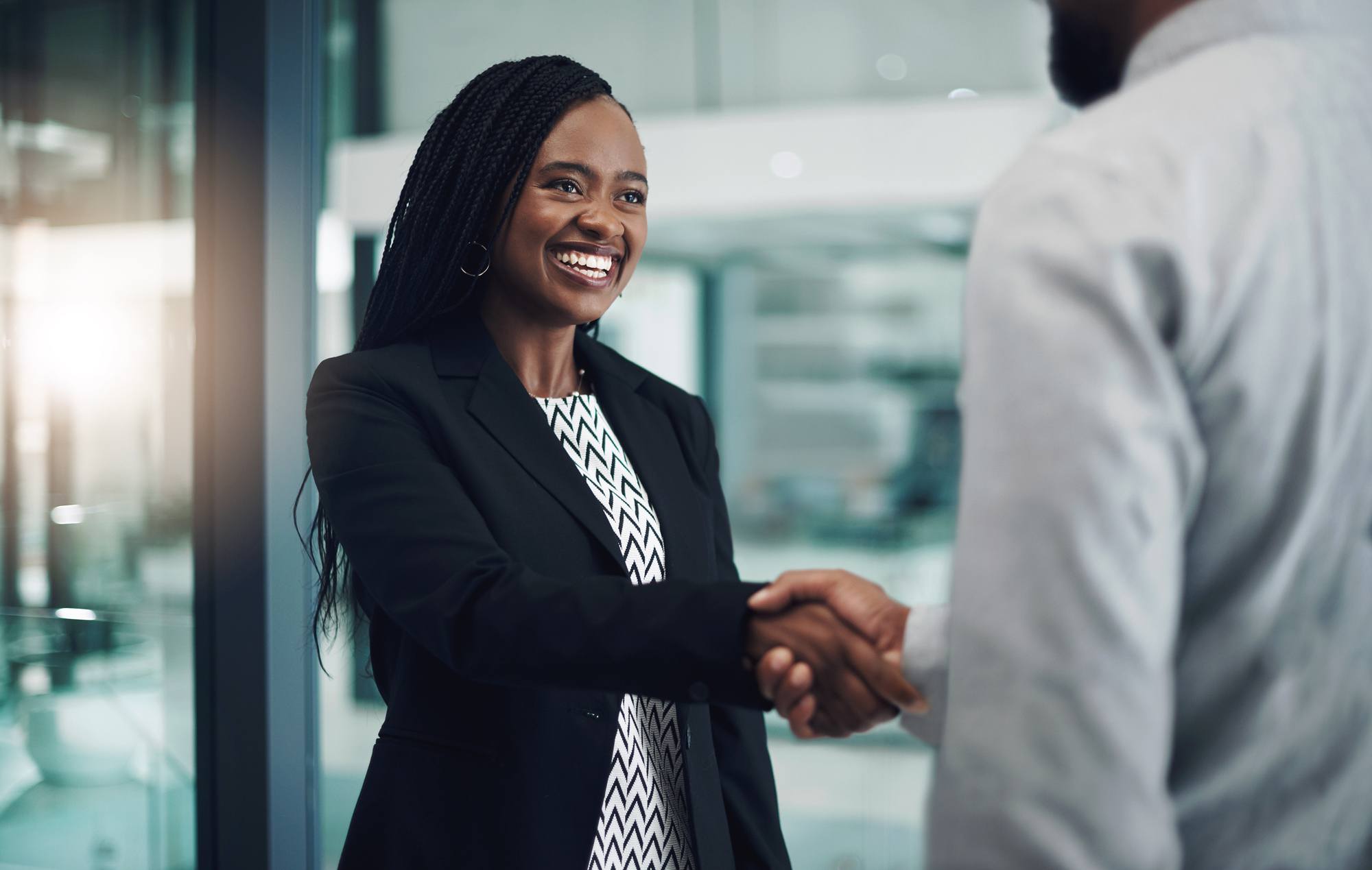 businesswoman shaking hands with a colleague