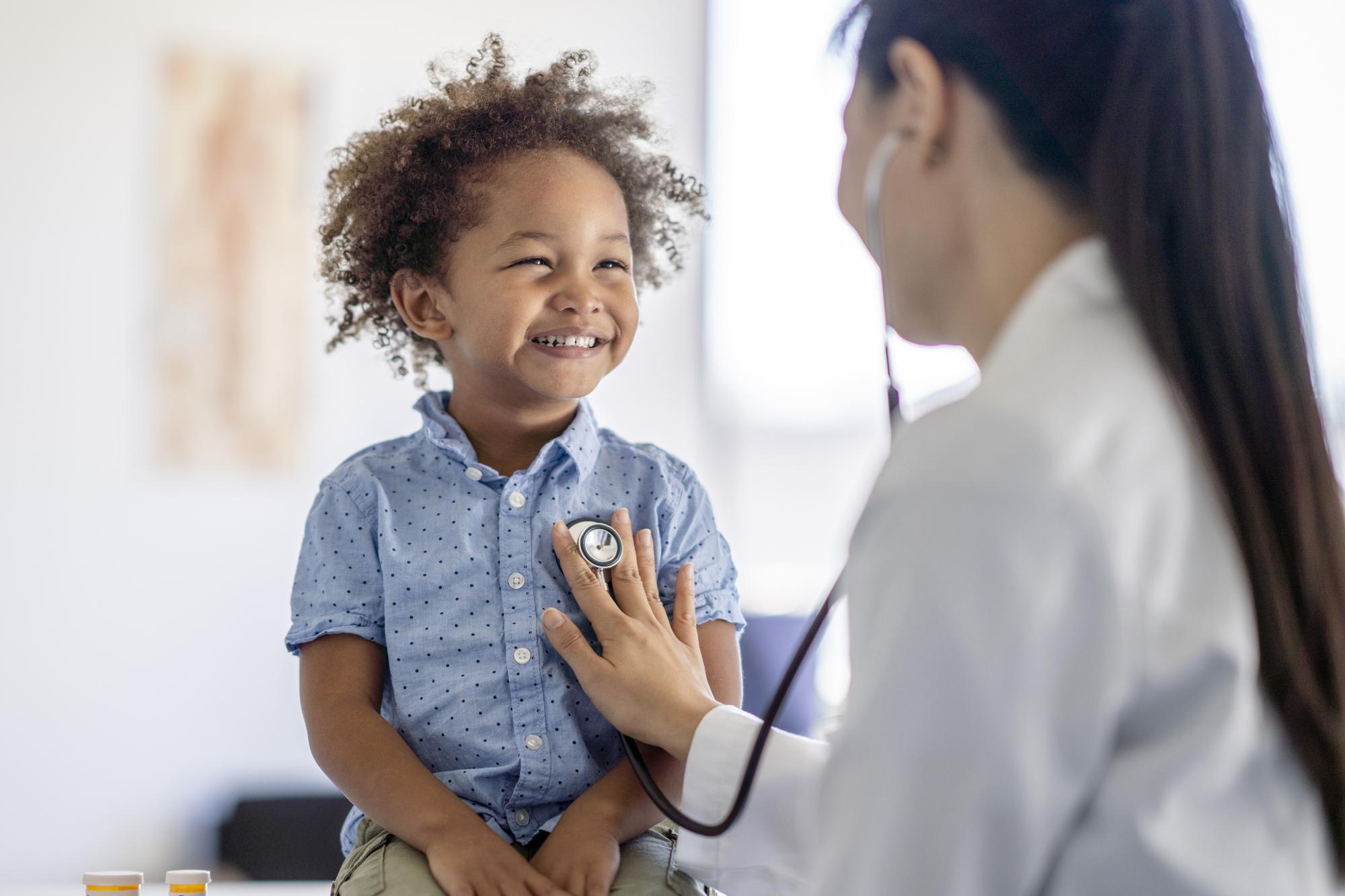 Doctor Listening to Little Boys Heart