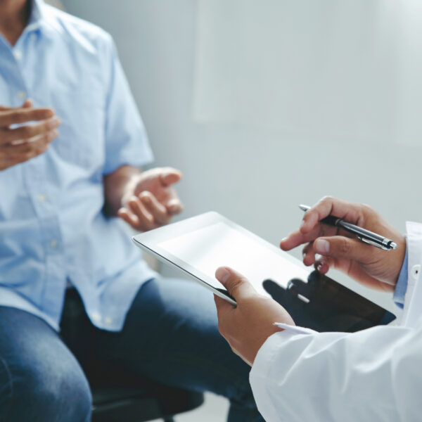 Doctor talking to patient explaining treatment