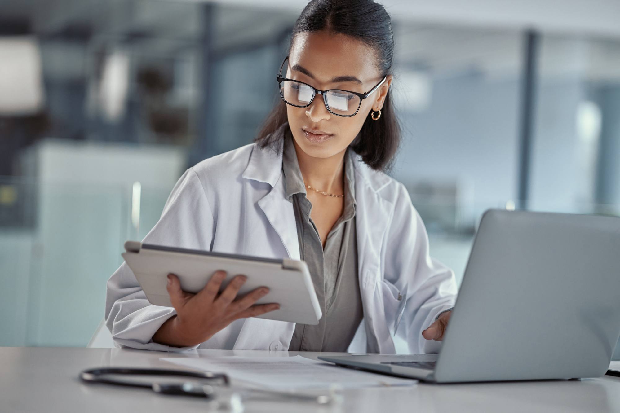 doctor using a digital tablet at work