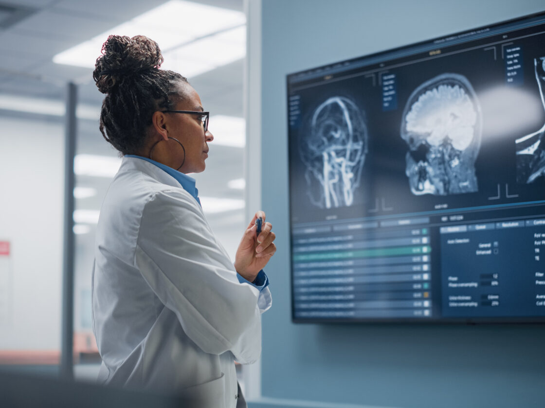 Neurologist looks at MRI Scan