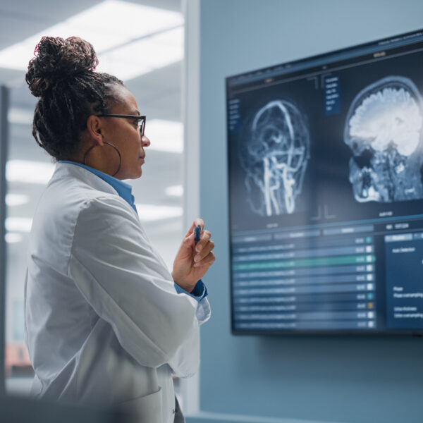 Neurologist looks at MRI Scan