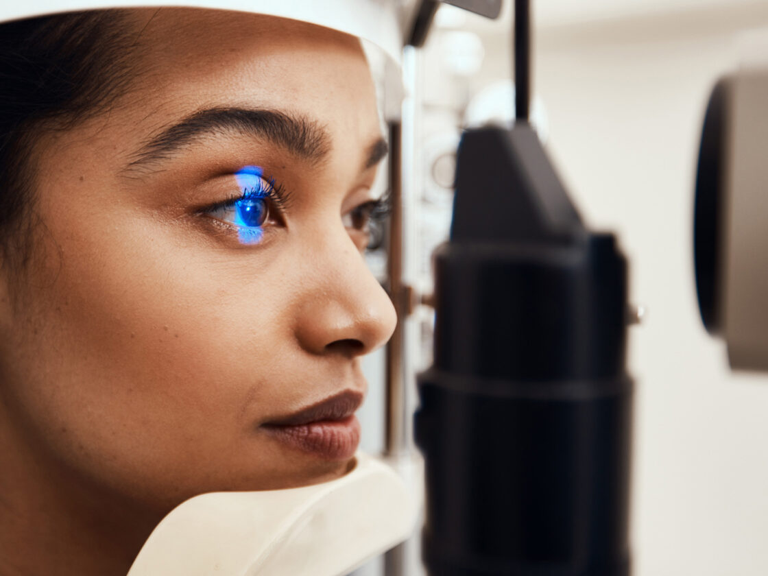 woman getting eyes examined