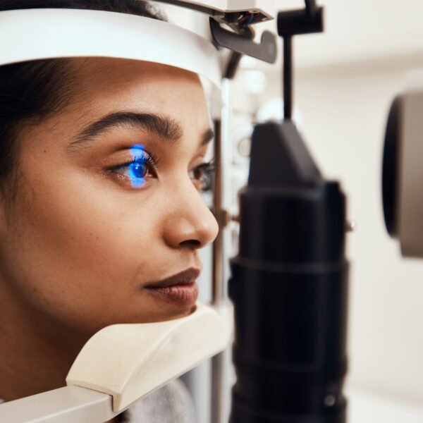 woman getting eyes examined