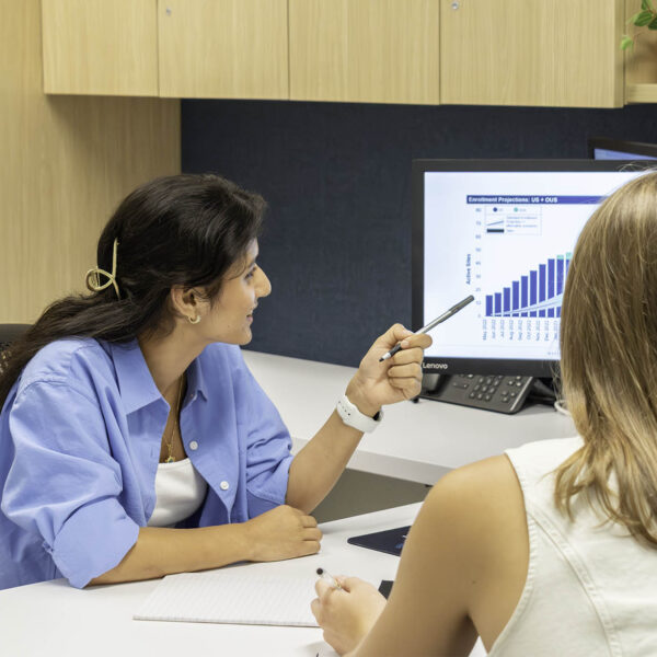 woman pointing to screen