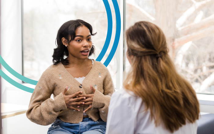 young woman talking to doctor